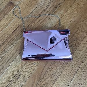 Pink metallic envelope clutch with chain strap